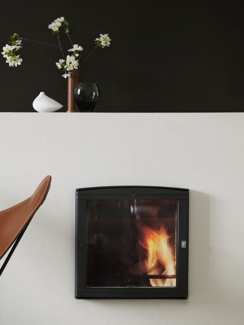 black wall behind white fireplace