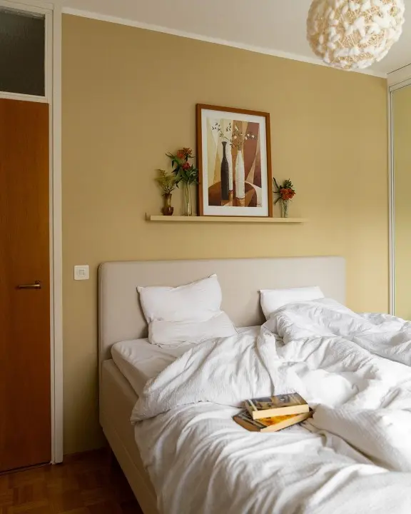 bedroom with light yellow colour wall