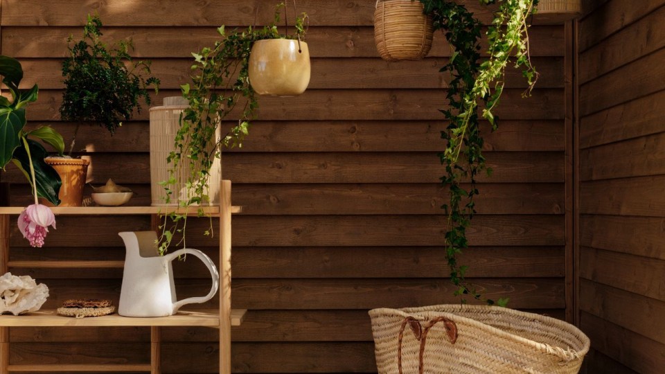 mother and daughter on terrace with gardening tools and furniture