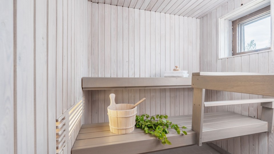 white colour sauna with light grey bench