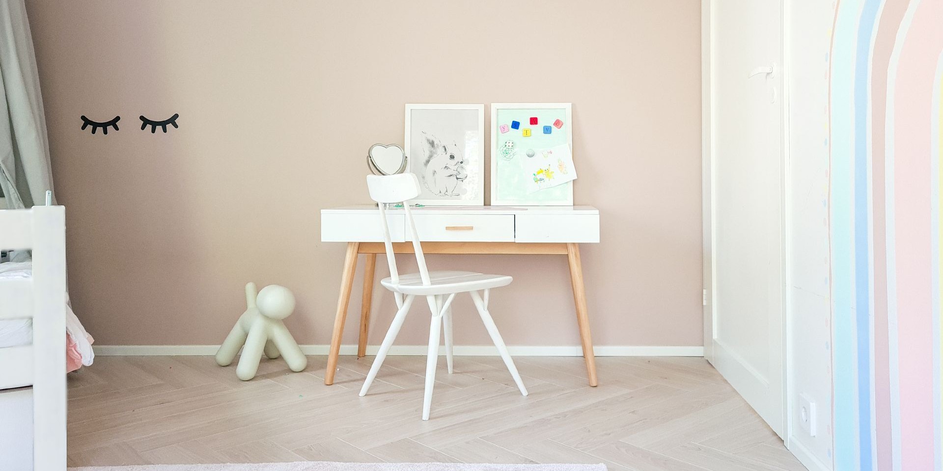 kids room with soft beige colour wall and pastel colour rainbow pattern