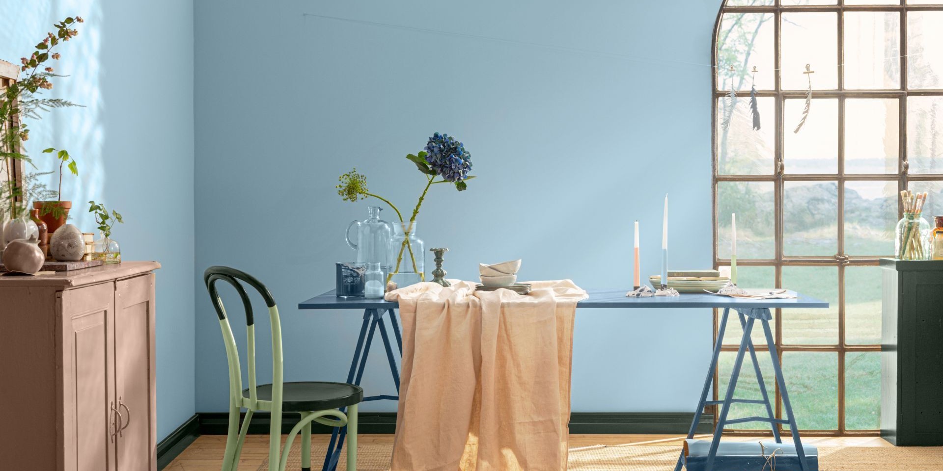 blue wall and table painted with green colours