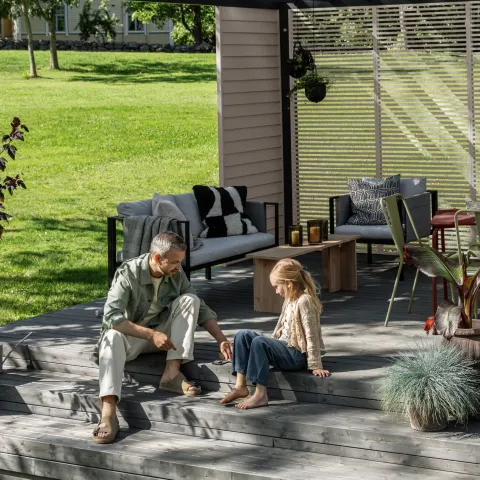 enjoying newly painted wooden decking