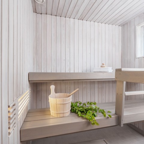 white colour sauna with light grey bench