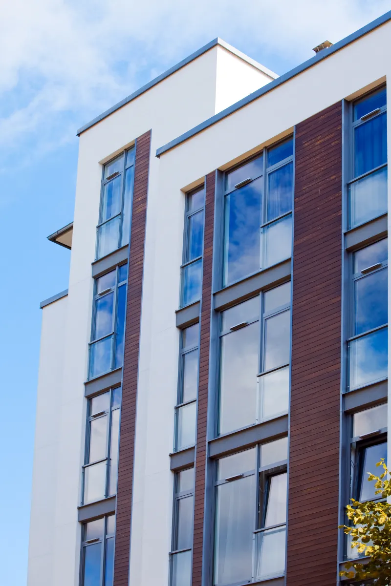 White mineral facade in an apartment building