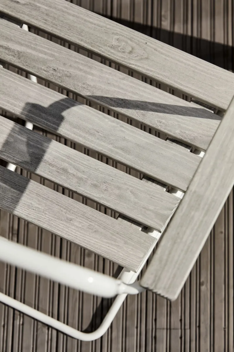 grey garden chair on dark colour terrace 