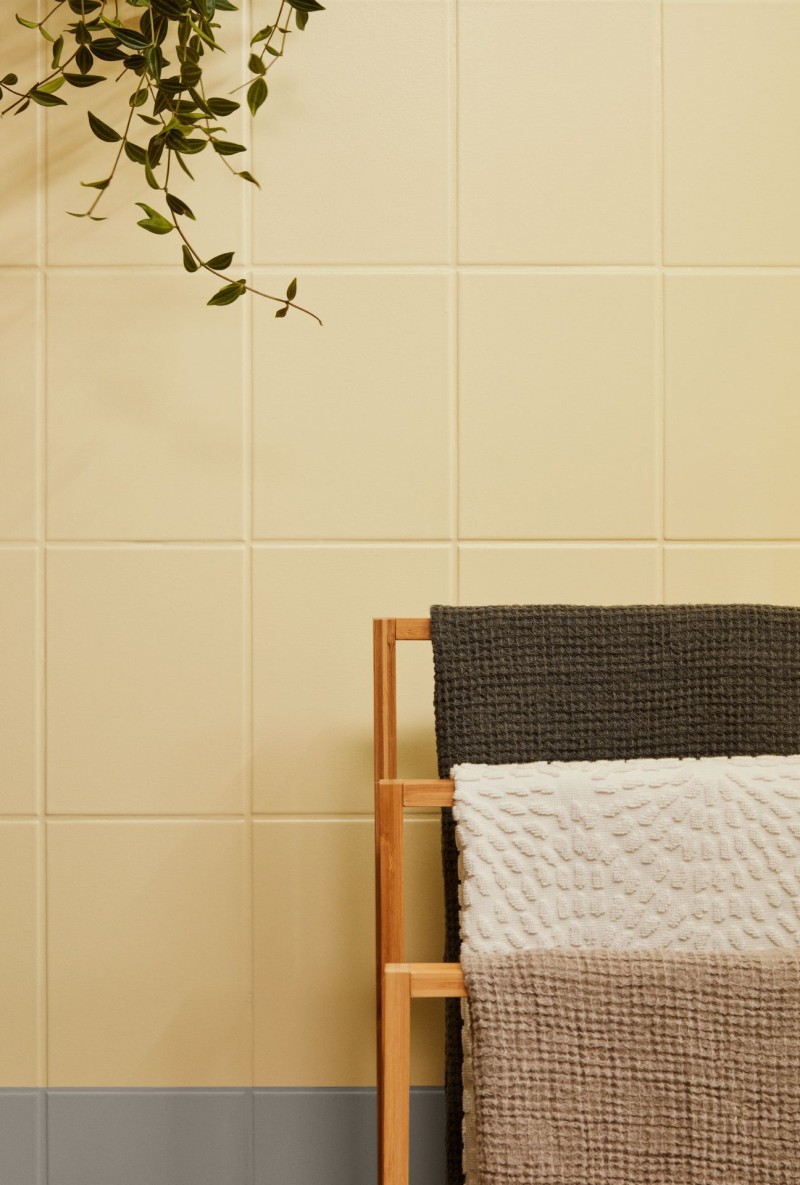 bathroom tiles painted in bright yellow and grey colour